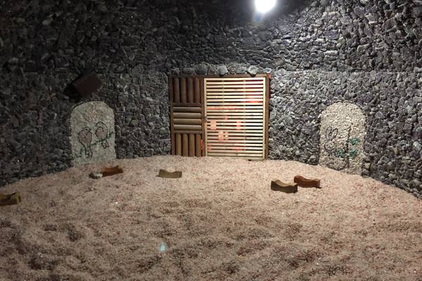 Inside a kiln sauna room at a jjimjilbang in Wonju: a heated floor of crushed stone with wooden block pillows